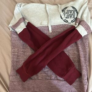 It’s a medium women’s pink sweater with hood